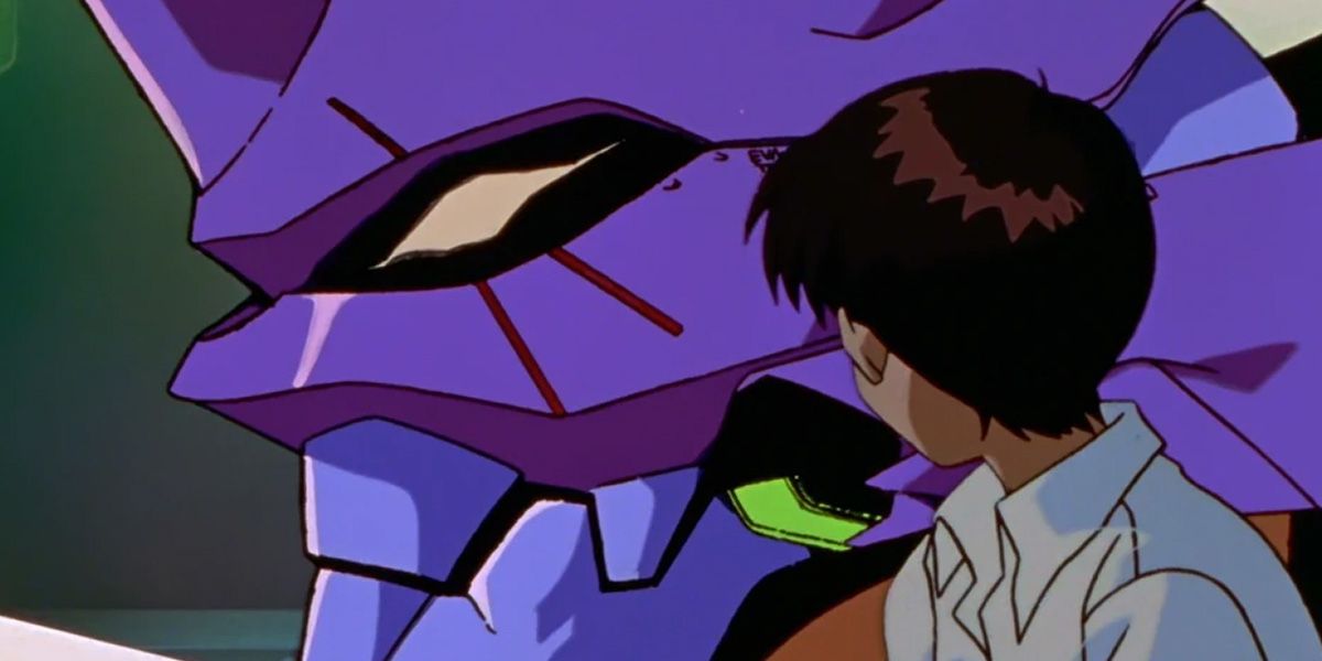 Shinji Ikari looks at the head of Evangelion Unit-01.