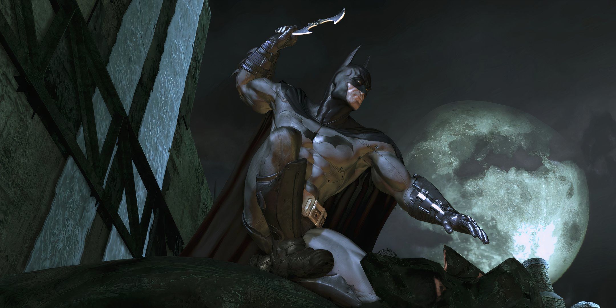 Batman holding a batarang. 