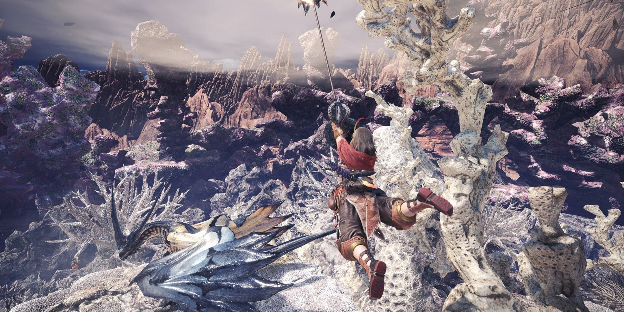 Hunter swings towards an ice dragon.