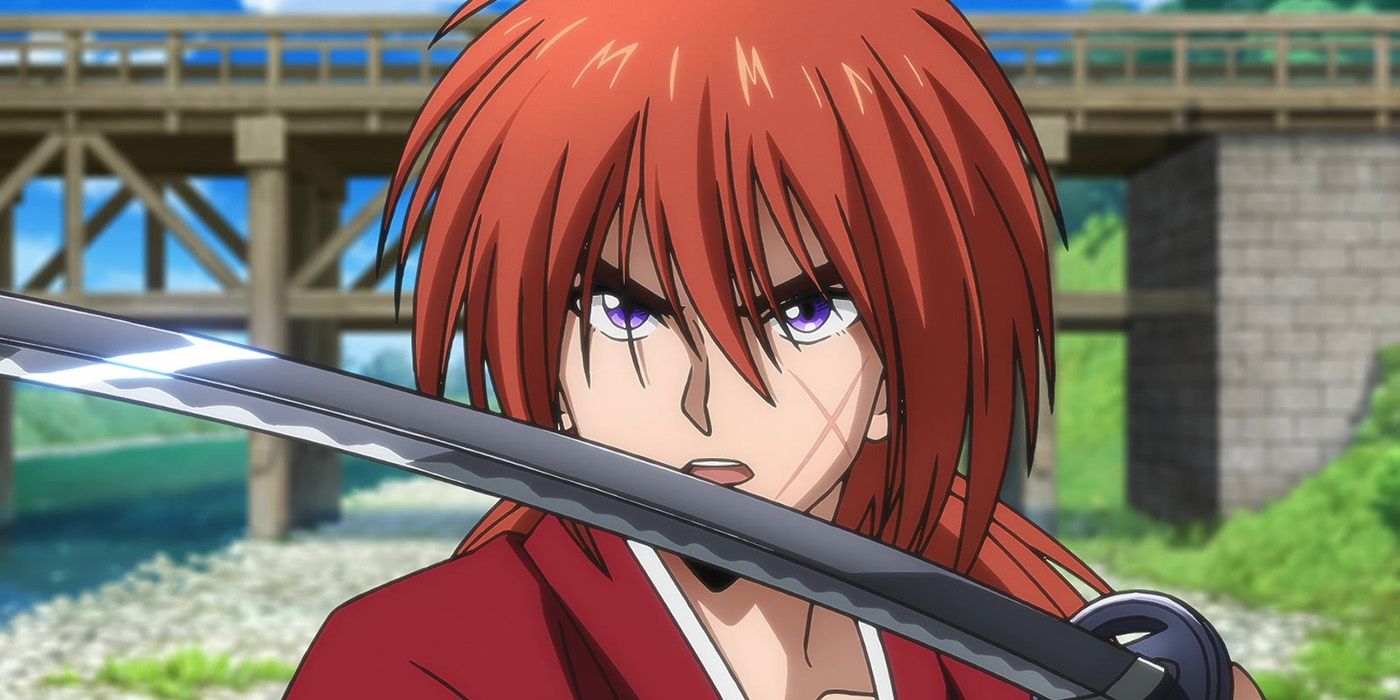 The updated design of Himura for Rurouni Kenshin in 2023. Himura has medium length red hair and holds a sword.