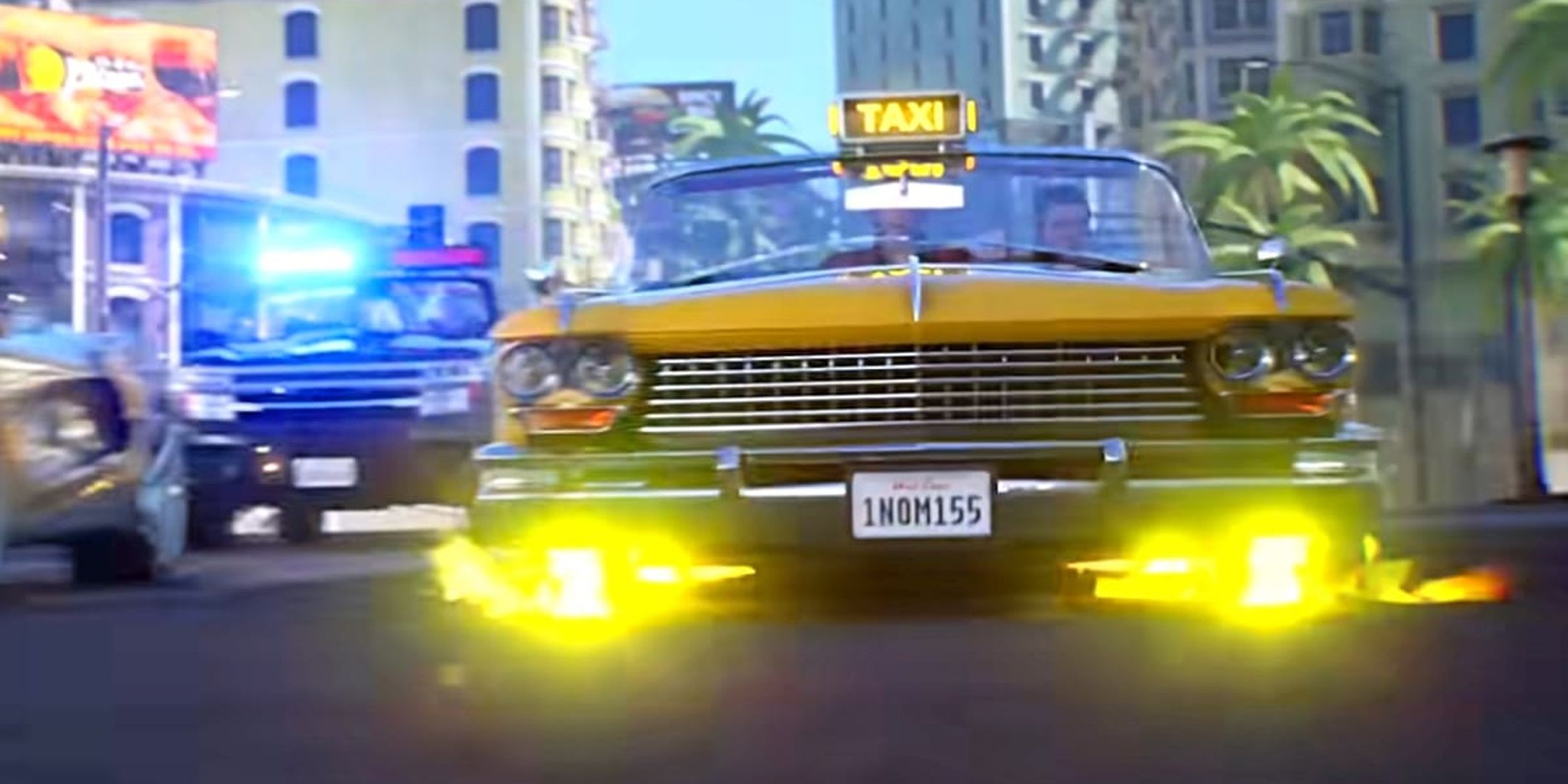 Yellow Crazy Taxi being chased down the road by a police car