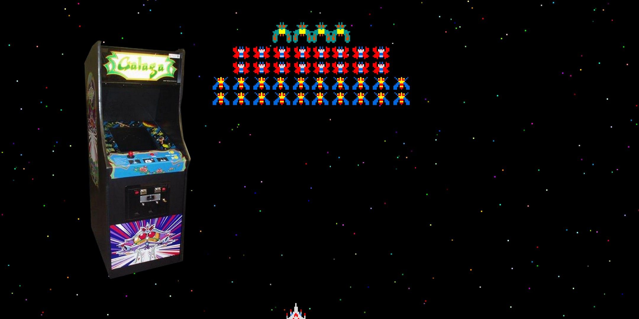 Green, red and blue aliens at the top of the screen, the Galaga cabinet on the left and the white player ship at the bottom