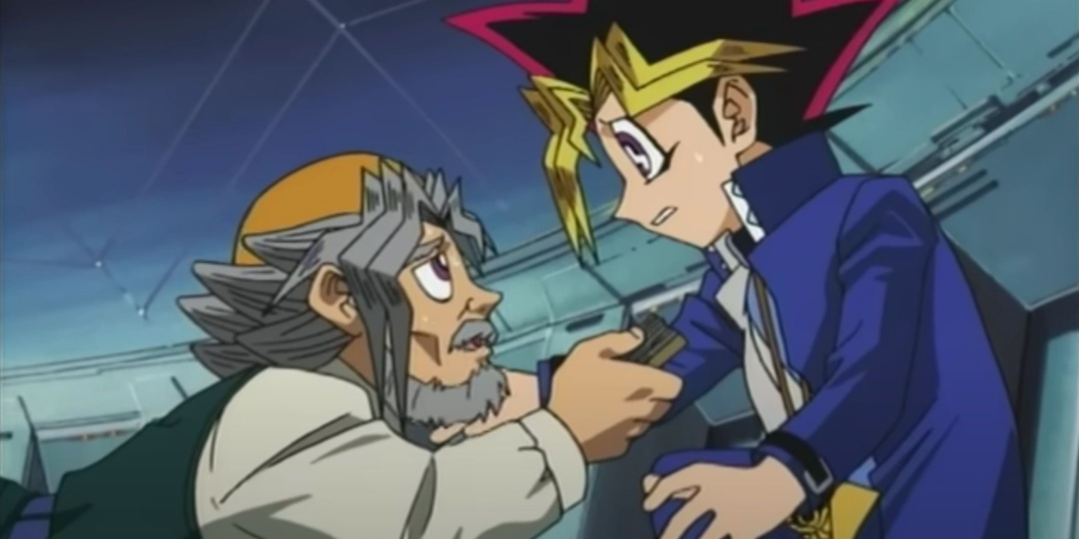 Yugi's Grandpa hands Yugi his deck.