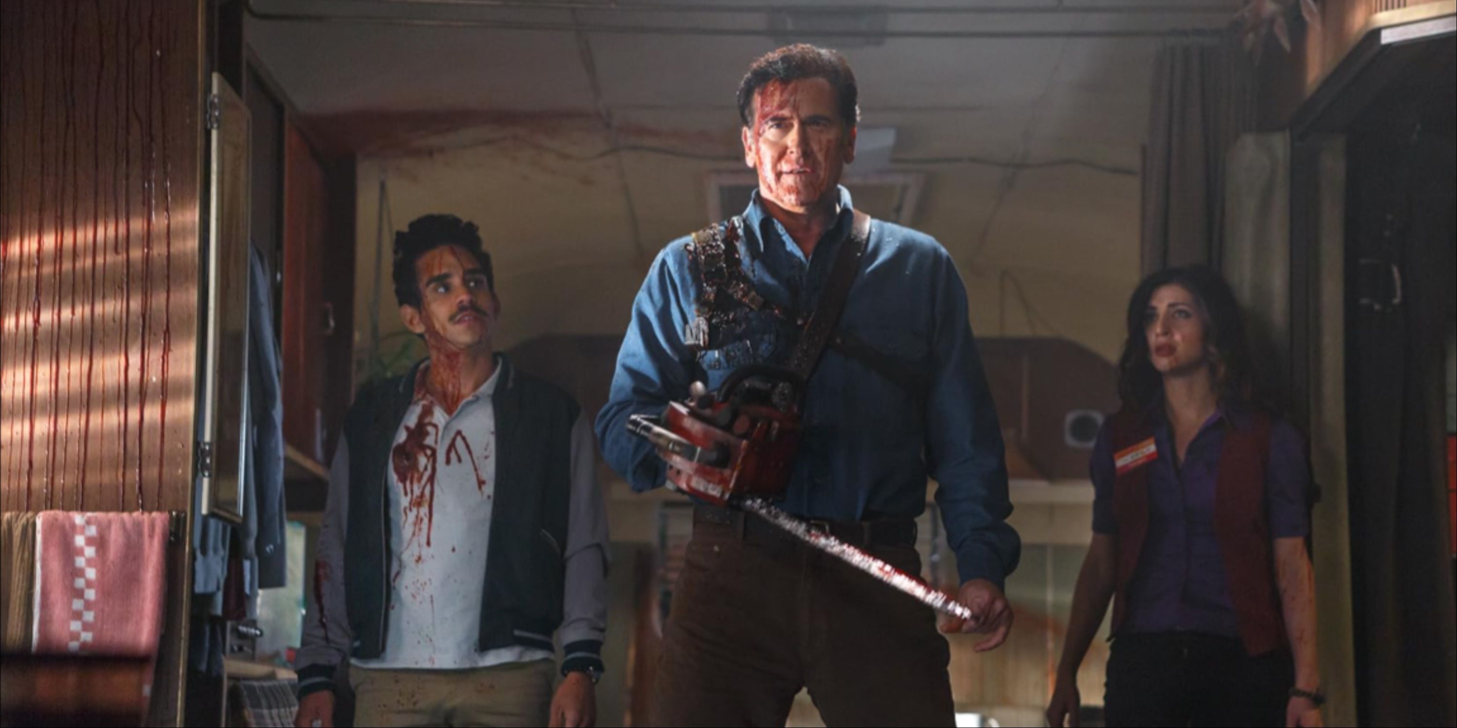 A Bloody Ash Williams With His Chainsaw, Pablo, And Kelly Inside Ash's Trailer In Ash Vs Evil Dead.