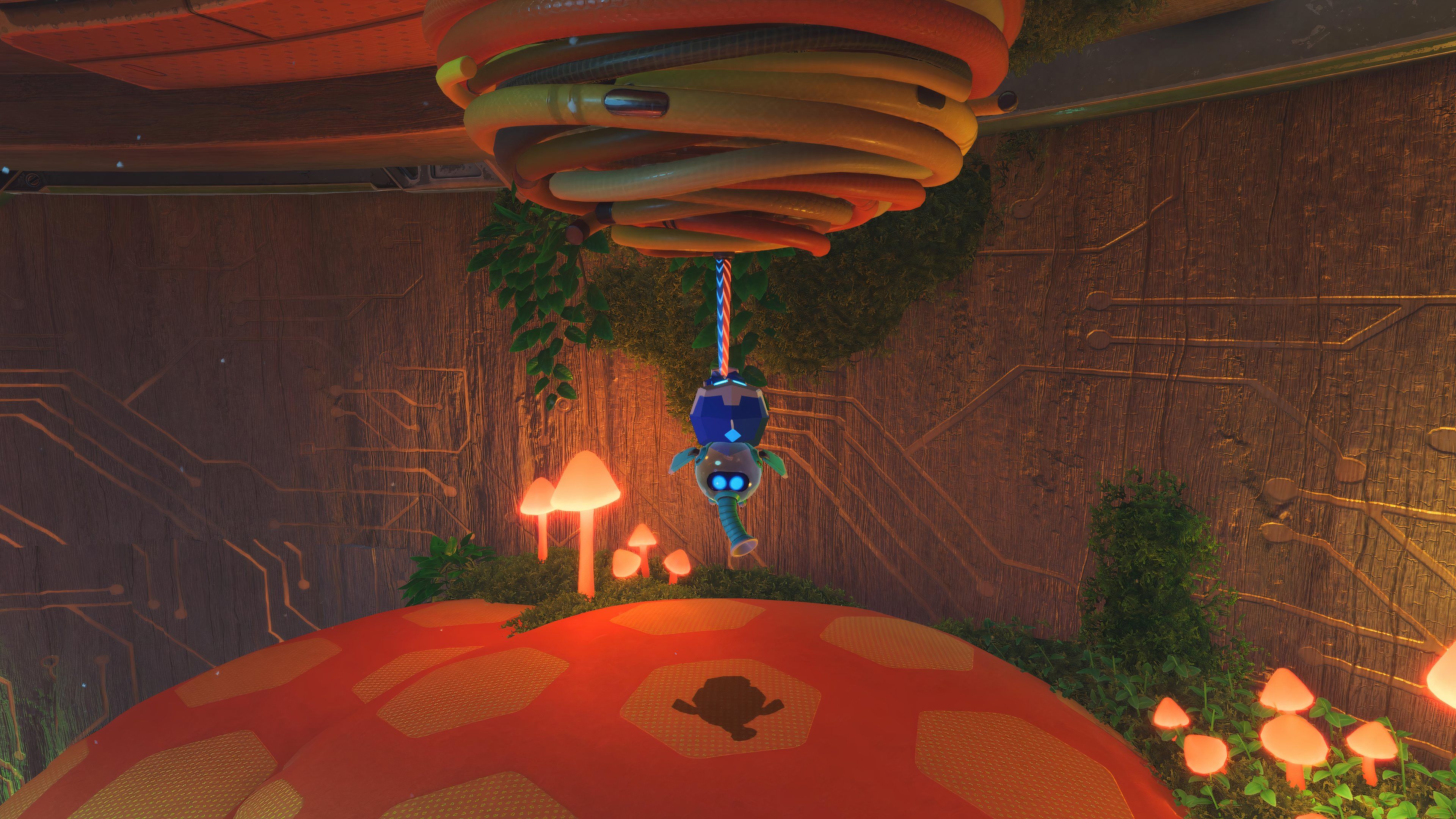 Astro Bot Trunk of Funk hanging from a wire on the mushroom podium