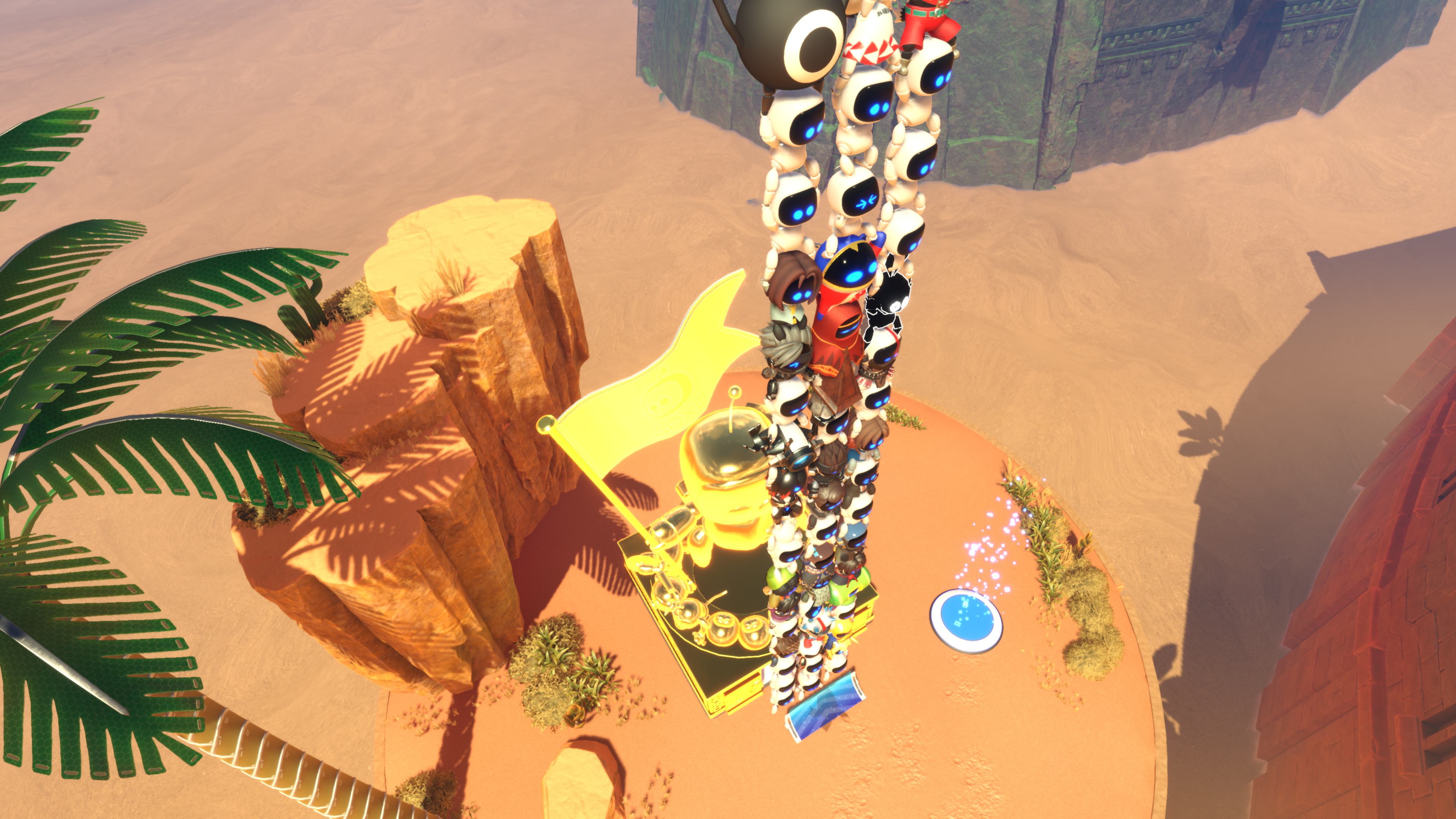 Astro Bot climbing next to the Golden Statue