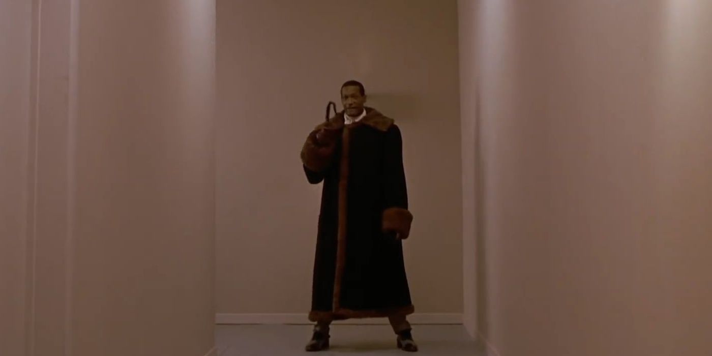 Image of the Candyman standing at the end of the hallway from the movie The Candyman.