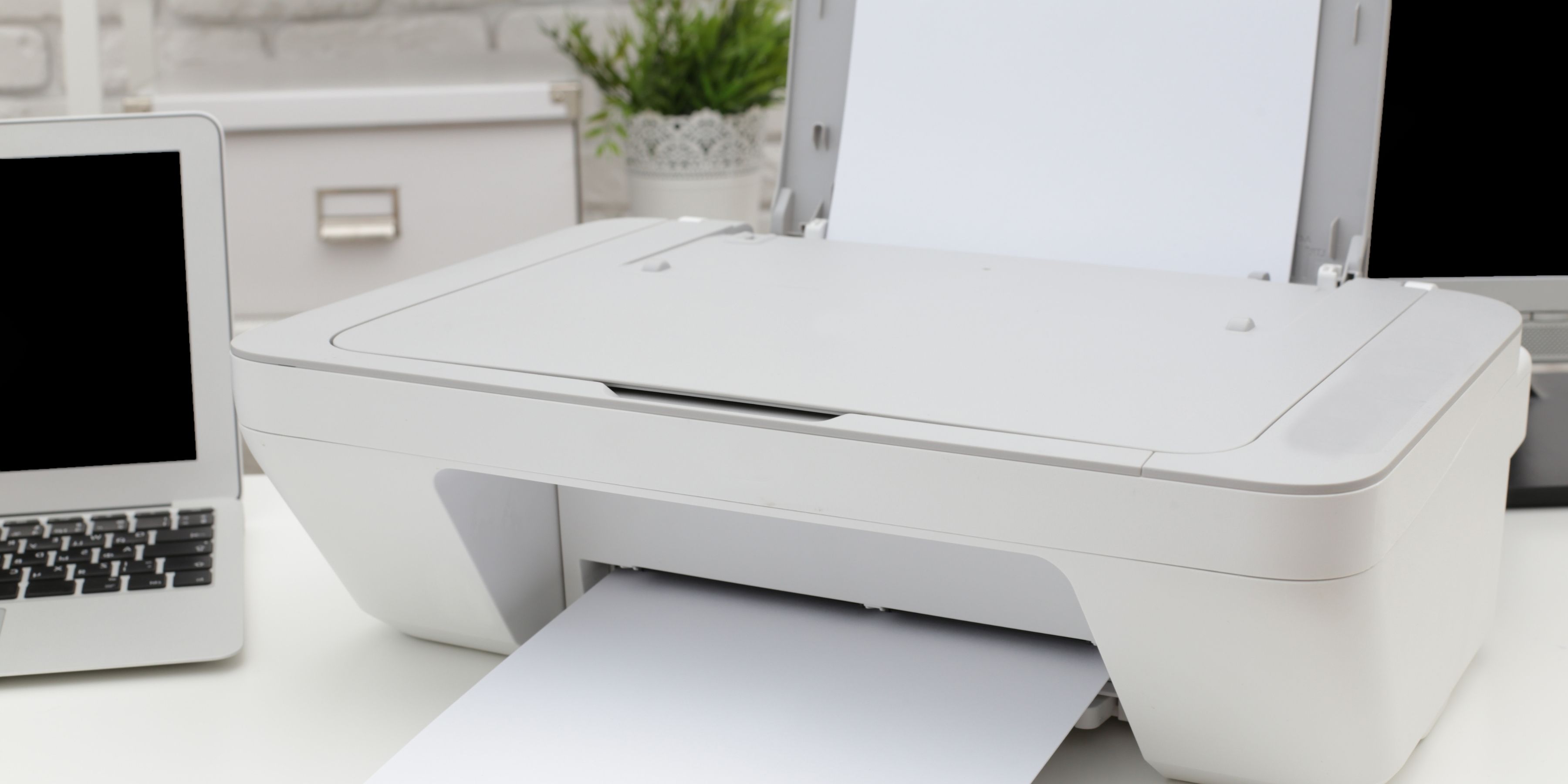 Image of printer on a desk.