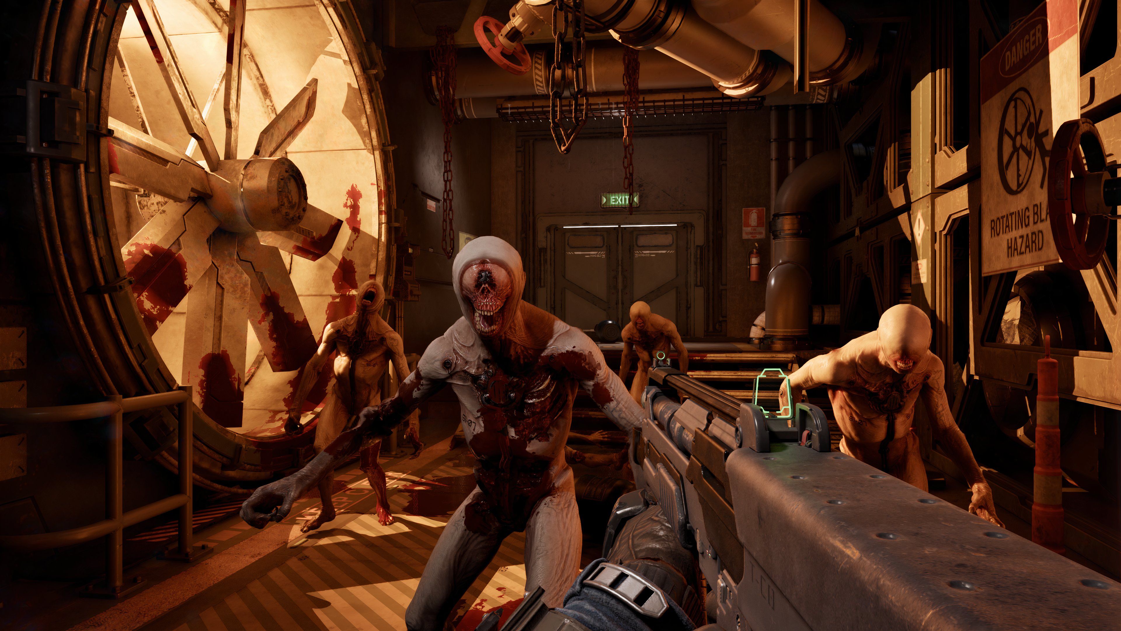 The player holding a shotgun against a group of four Zeds.