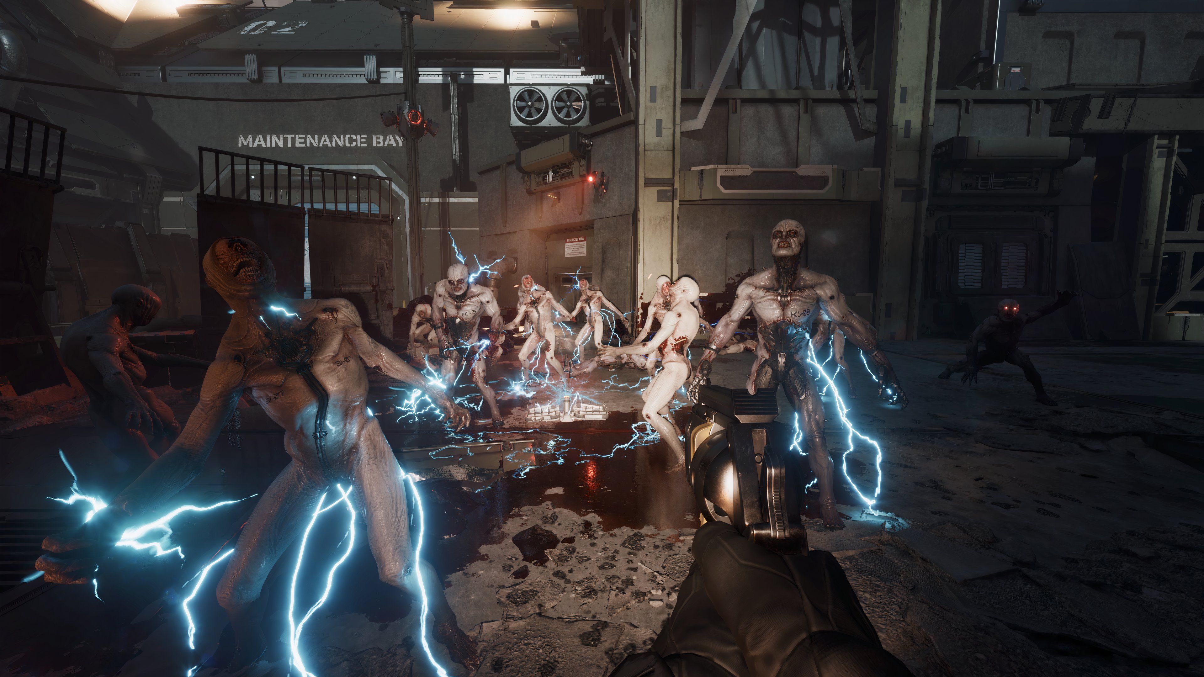 The player holding a revolver while a group of regular Zeds are being electrified.