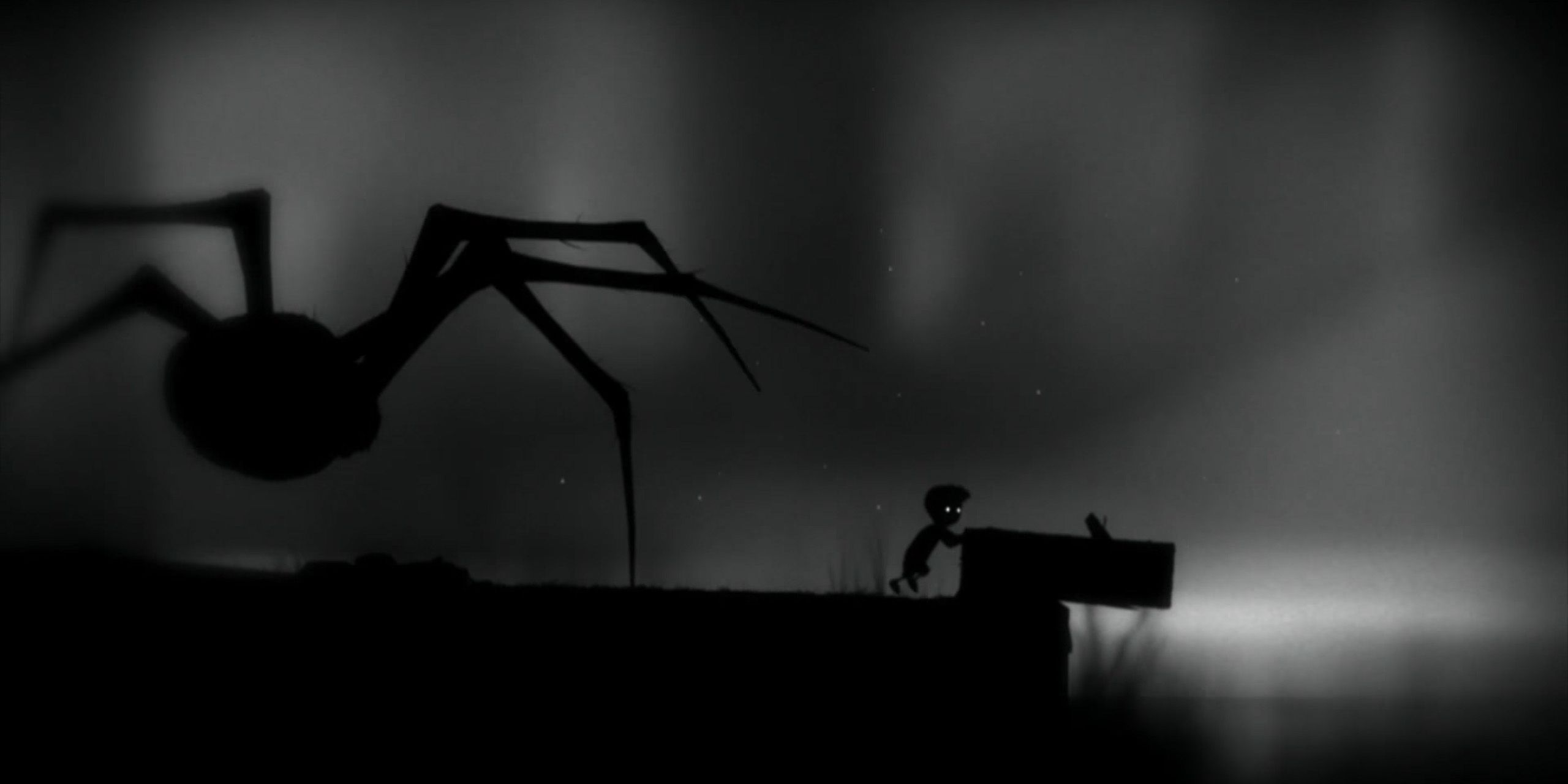 The boy from Limbo pushing a box into a river while a giant spider creeps up from behind.