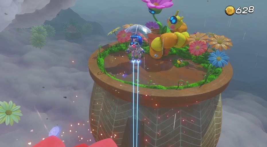 Astro Bot Balloon Breeze flying over to inflatable caterpillar