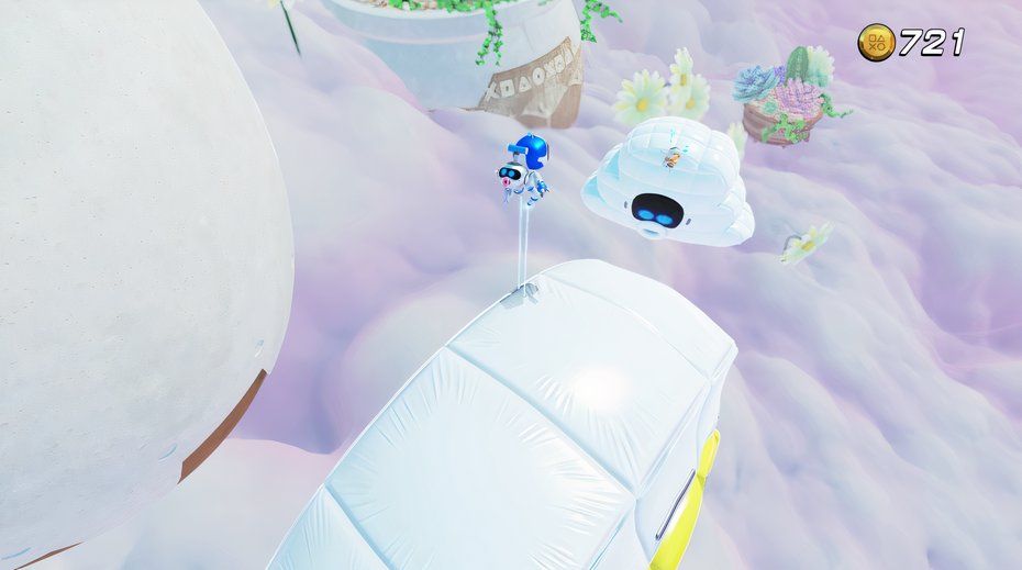 Astro Bot Balloon Breeze bot hanging onto inflatable cloud