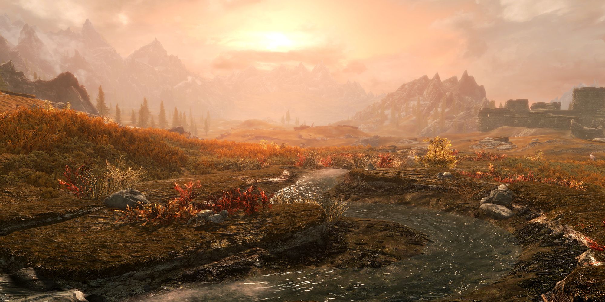 Looking at the sun setting over a small river in The Elder Scrolls 5: Skyrim.