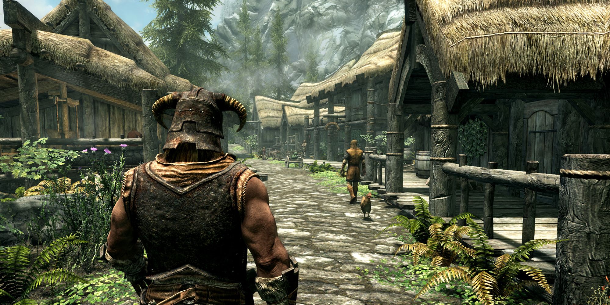 Dragonborn walking through a village in Skyrim.