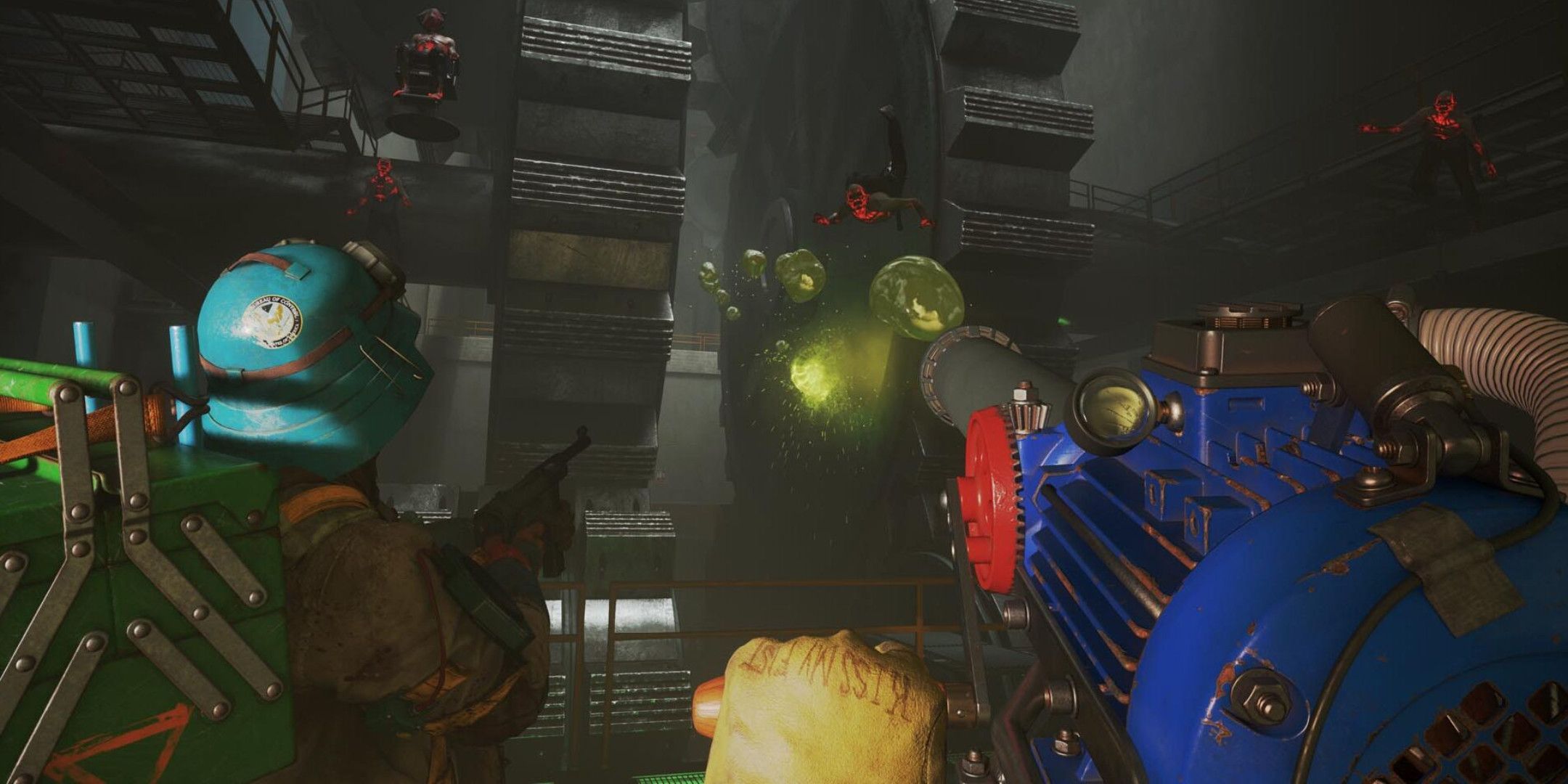 A man firing goo out of a large blue gun at floating red monsters