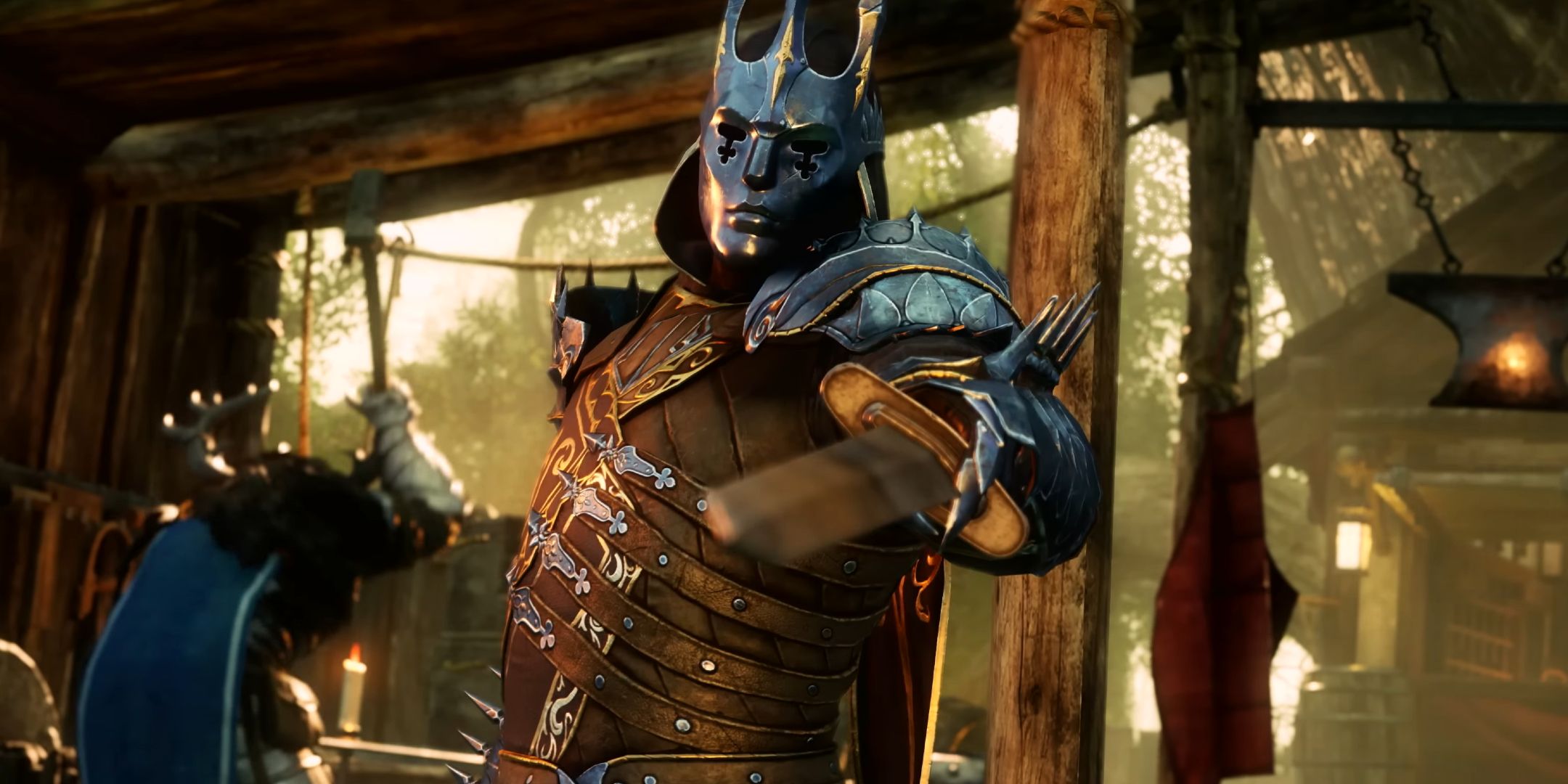 A person wearing armor and a metal mask pointing a sword toward the screen