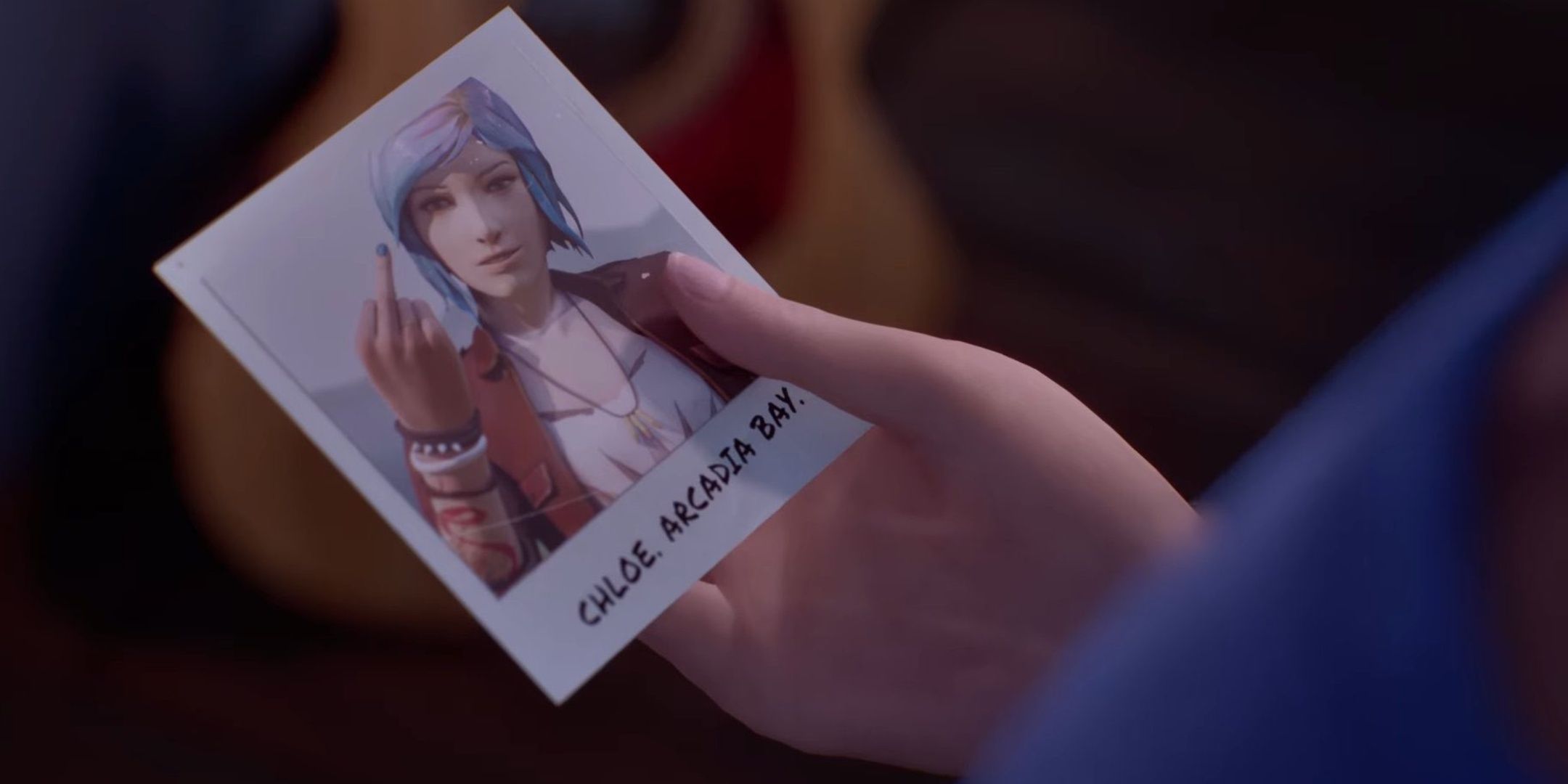 Max looking at a photo of Chloe in Life Is Strange: Double Exposure.