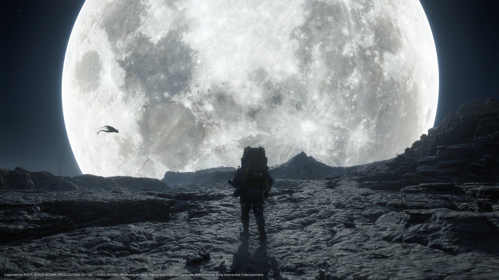 Sam Porter Bridges stands next to the moon in Death Stranding 2. 