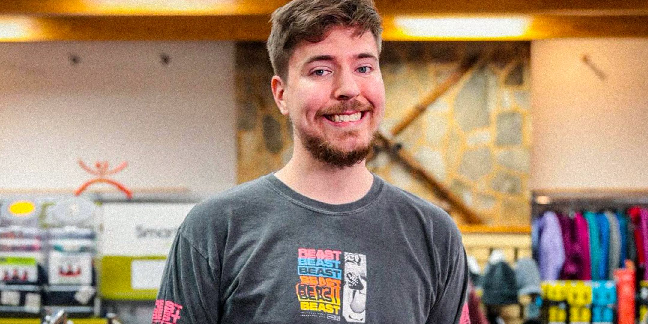 MrBeast smiles for a photo in a store