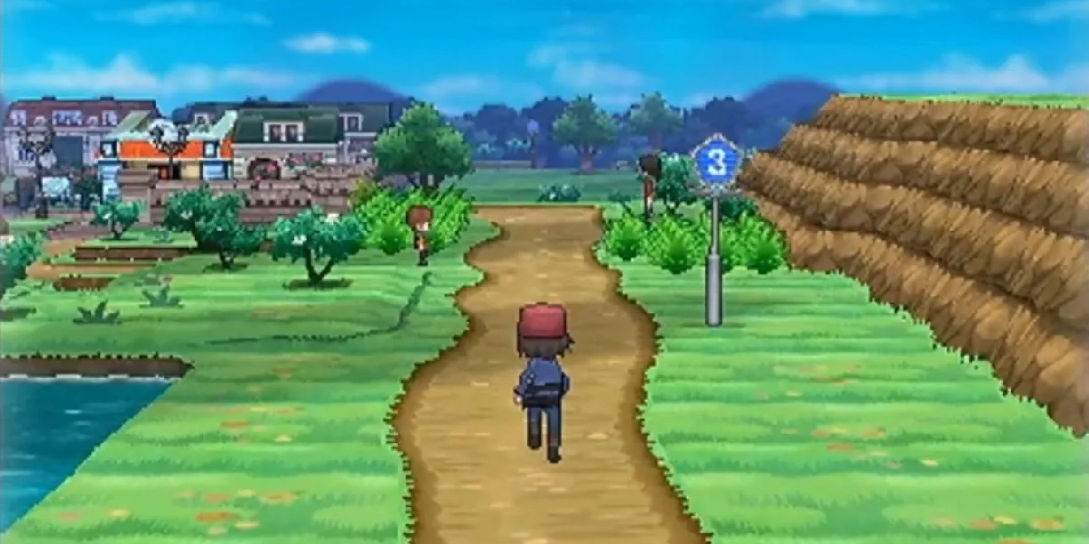 Pokemon X trainer running along a road towards a town