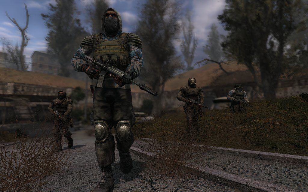 Armed soldiers walking in a group in Stalker: Clear Sky.