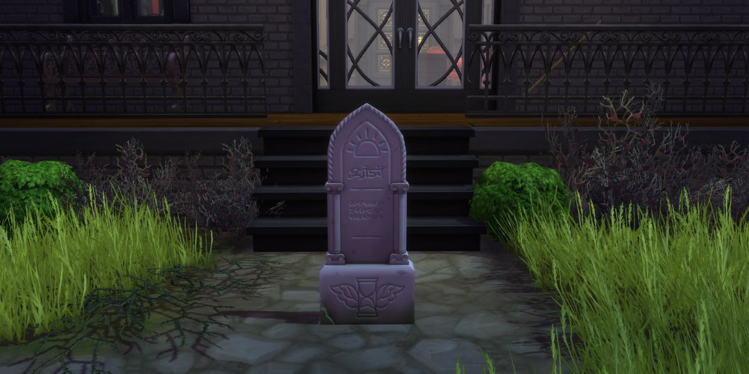 A gravestone sits with a hourglass engraved at the bottom. The hourglass has little wings.