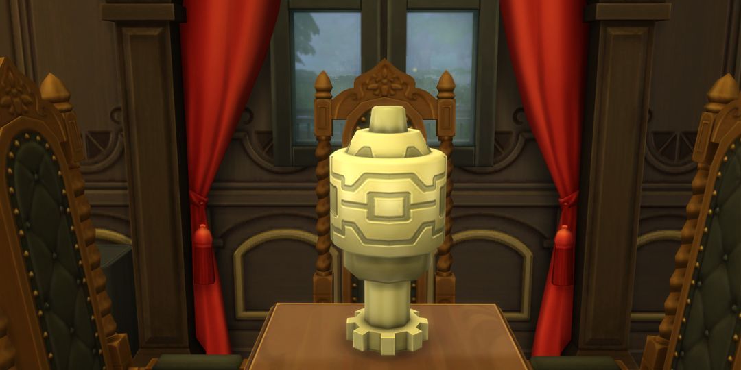 The Servo Urn from the Sims 4. It is a simple metallic urn with a gear bottom.