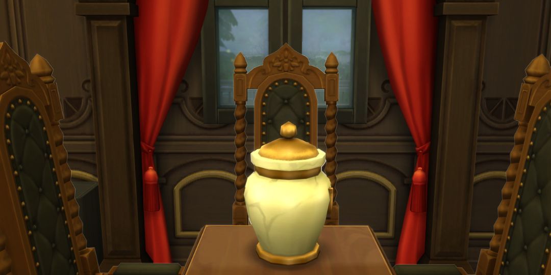 The simple urn from the Sims 4. It is a simple marble urn with a golden band and lid.