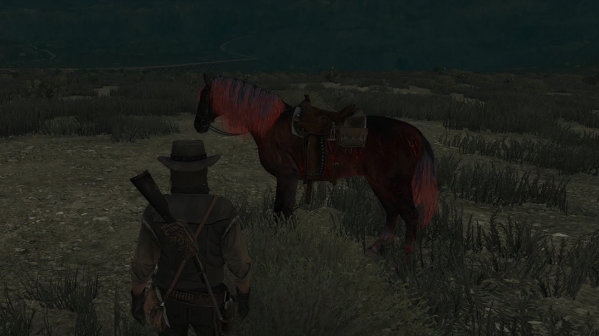 John Marston stares at a zombie undead horse at night in Red Dead Redemption.