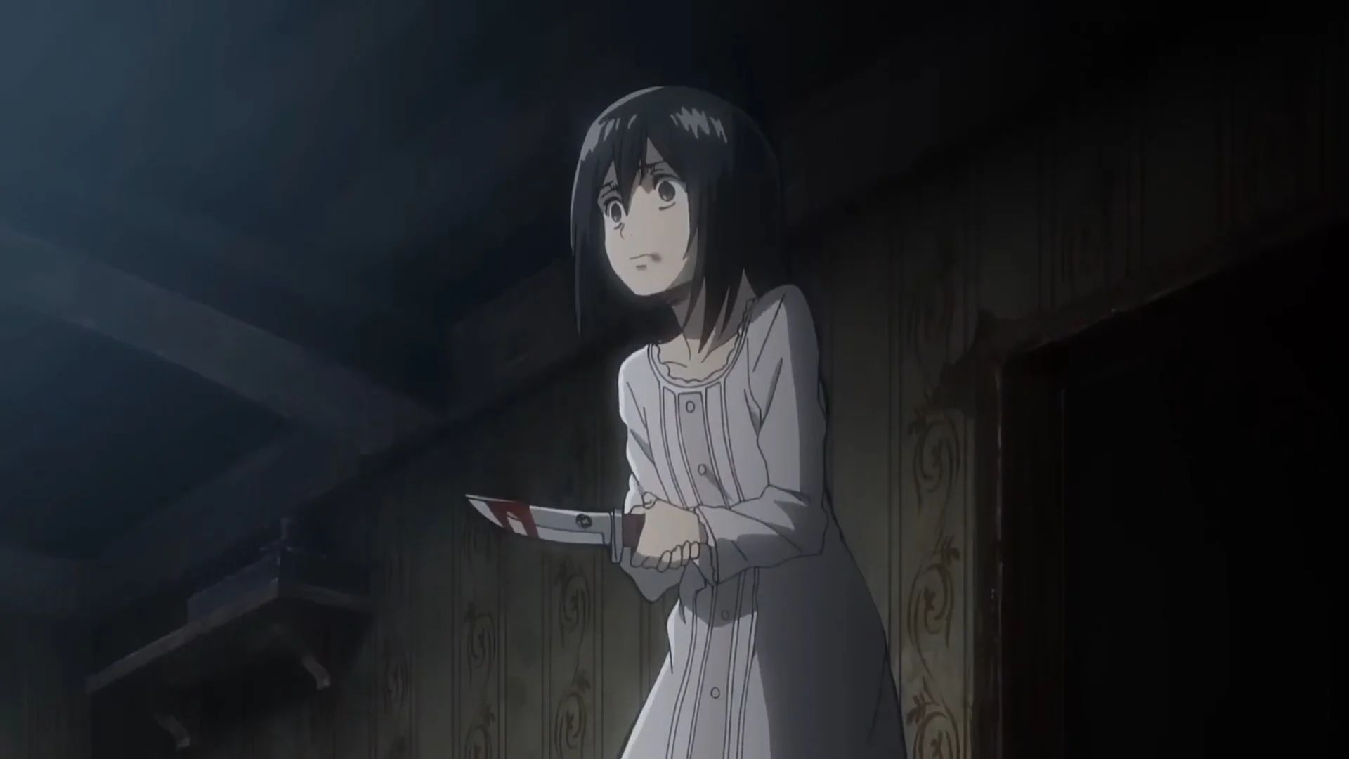 Mikasa holds a knife in Attack on Titan.