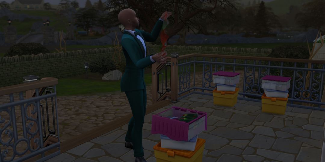 A Sim sorts through decorations outside.