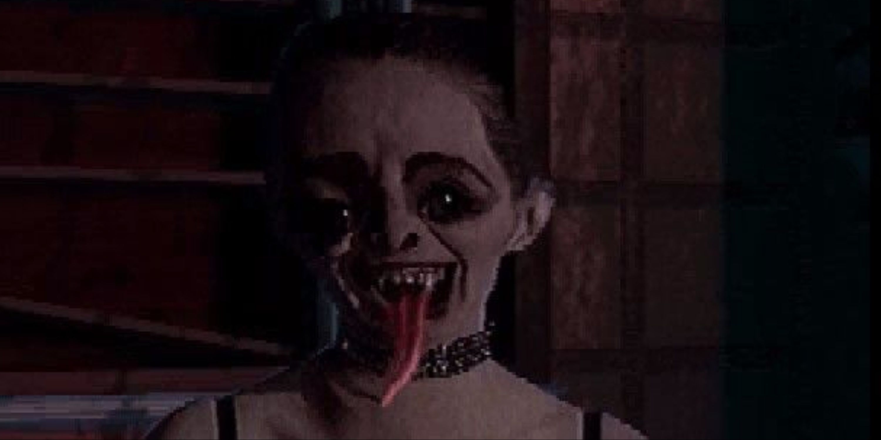 A close-up of a creepy woman with her tongue out in The 11th Hour FMV game.