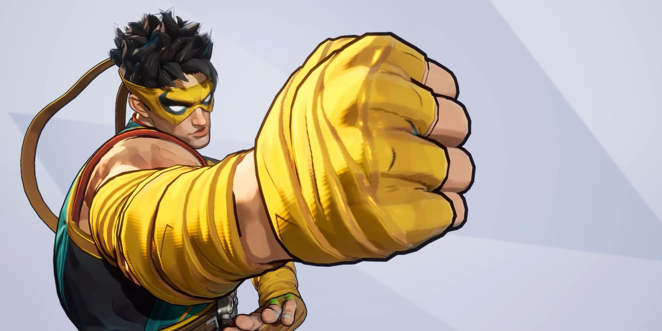 Iron Fist in Marvel Rivals. He is wearing a blue and gold costume, and is punching towards the screen