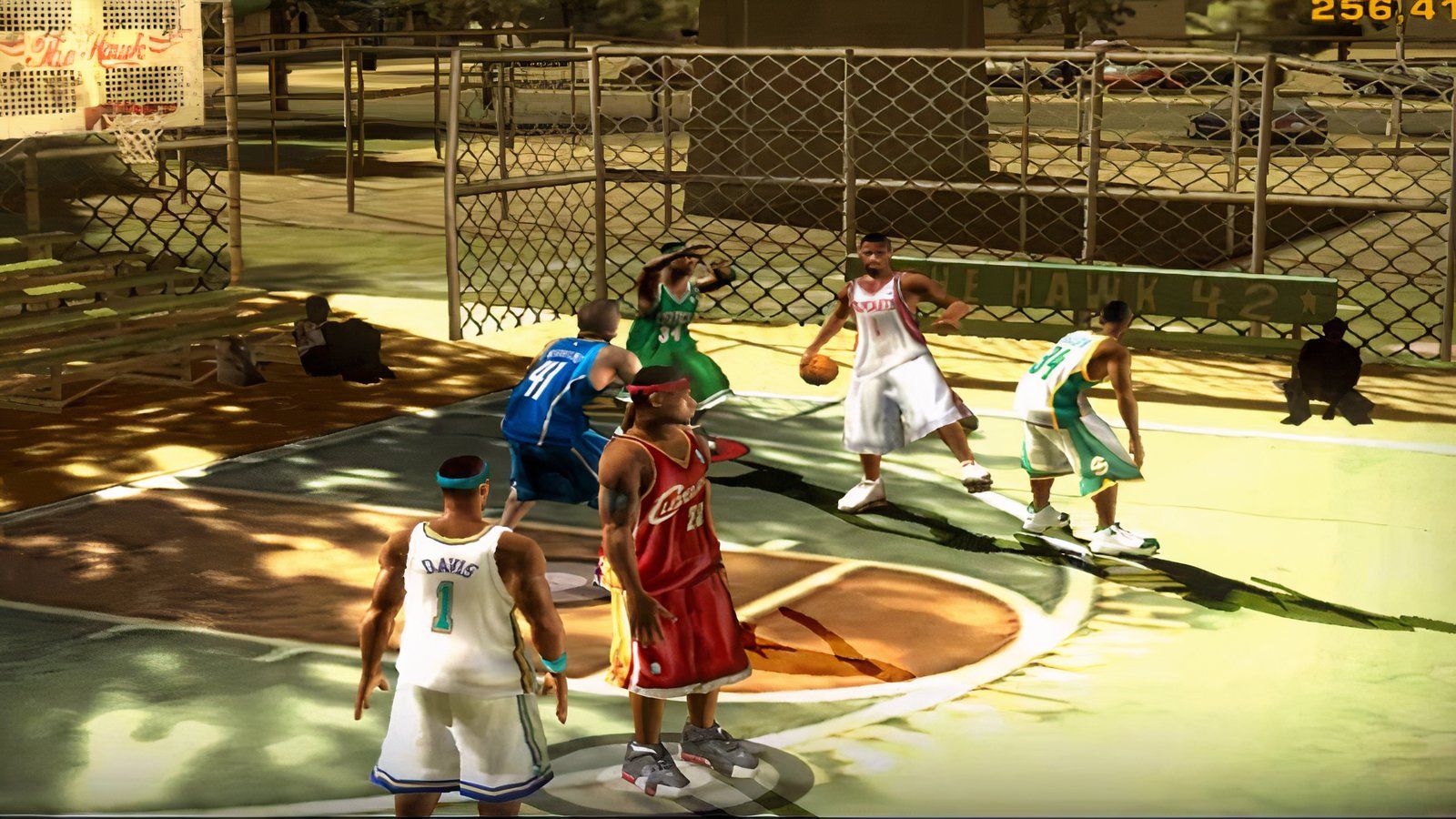 NBA Street V3 players playing a three-on-three match on a street basketball court.