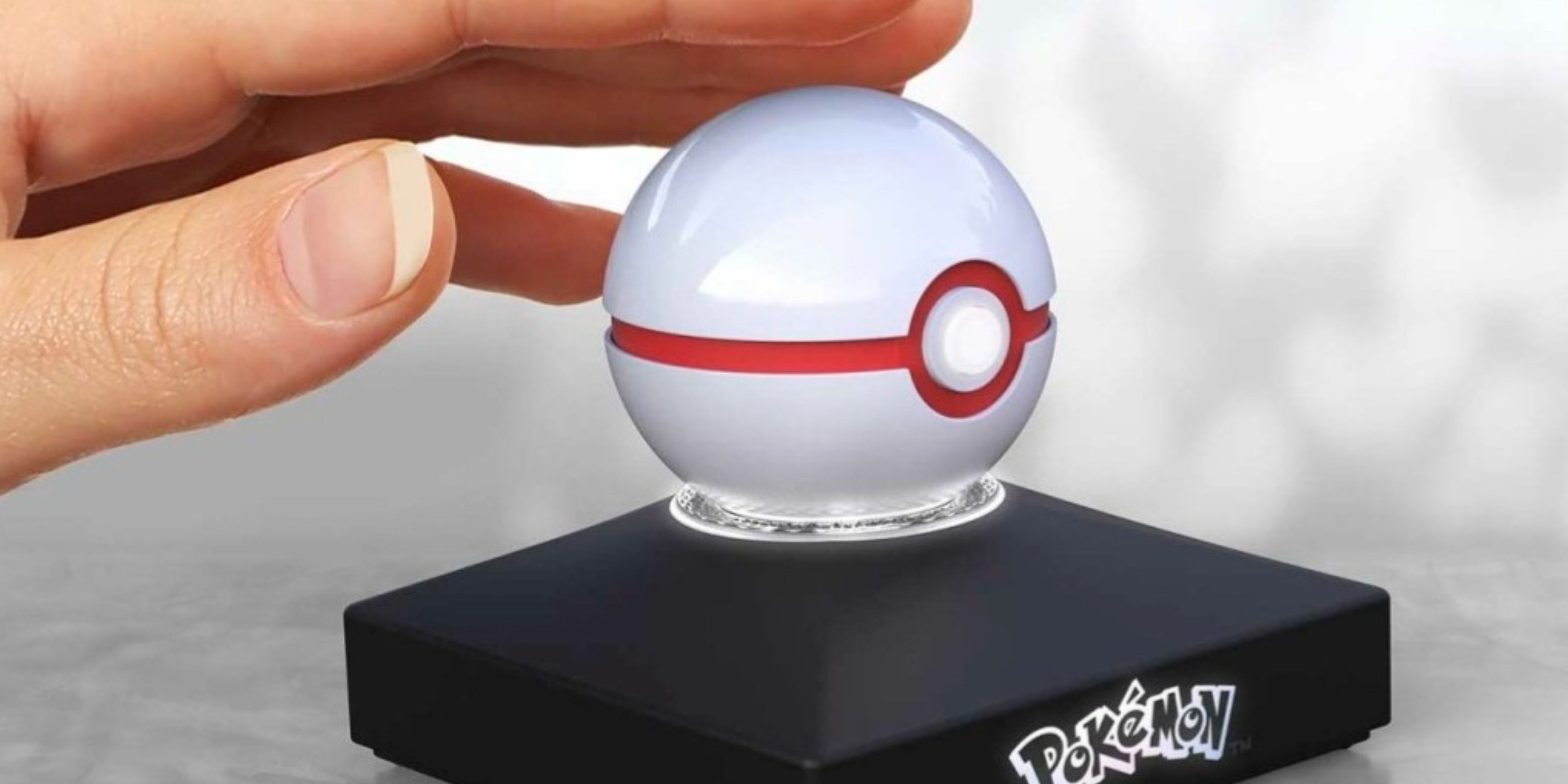 someone tapping the pokemon x the wand institution  mini premier shot  replica.