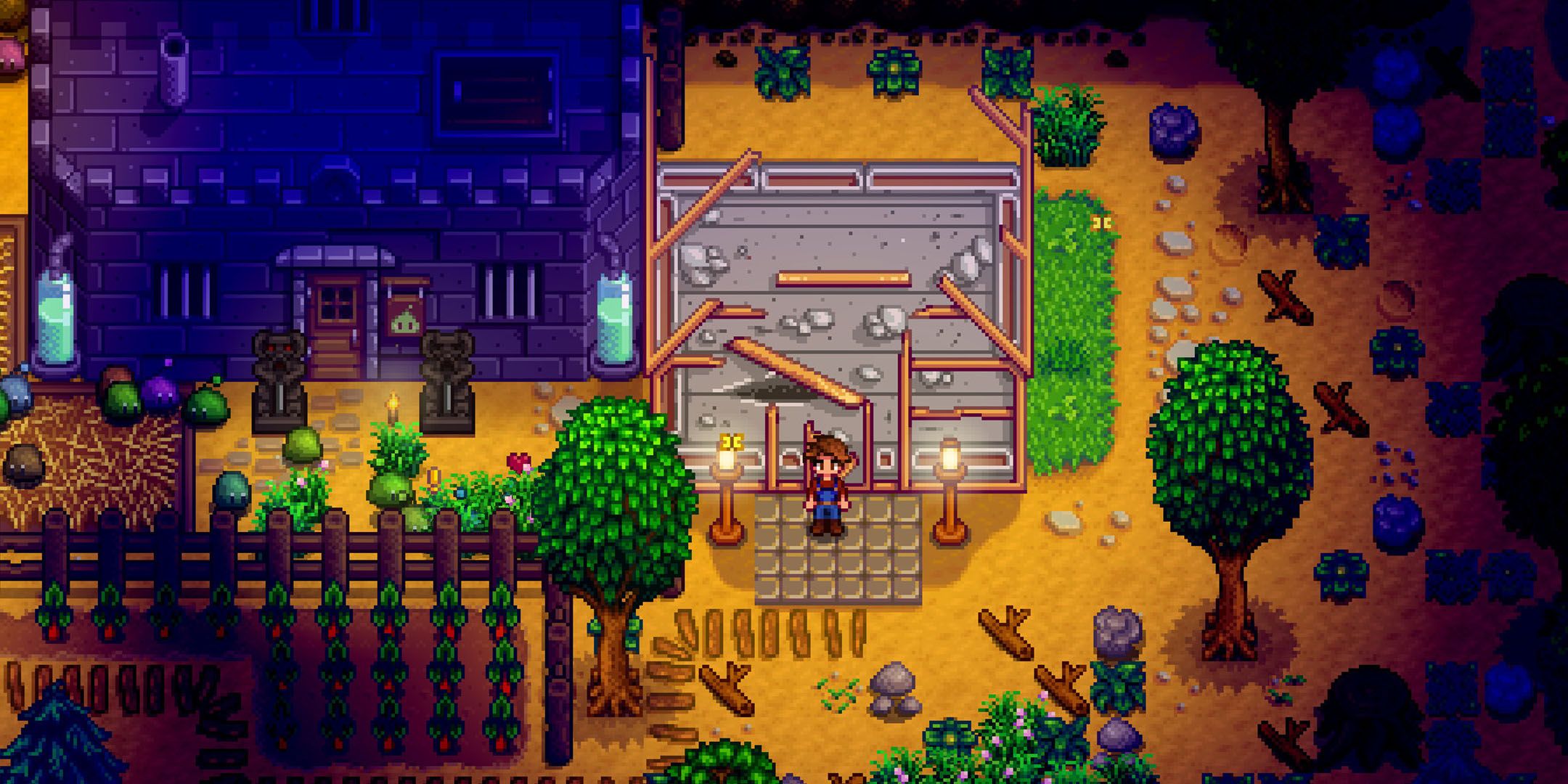 Stardew Valley player standing by a house in construction at night.