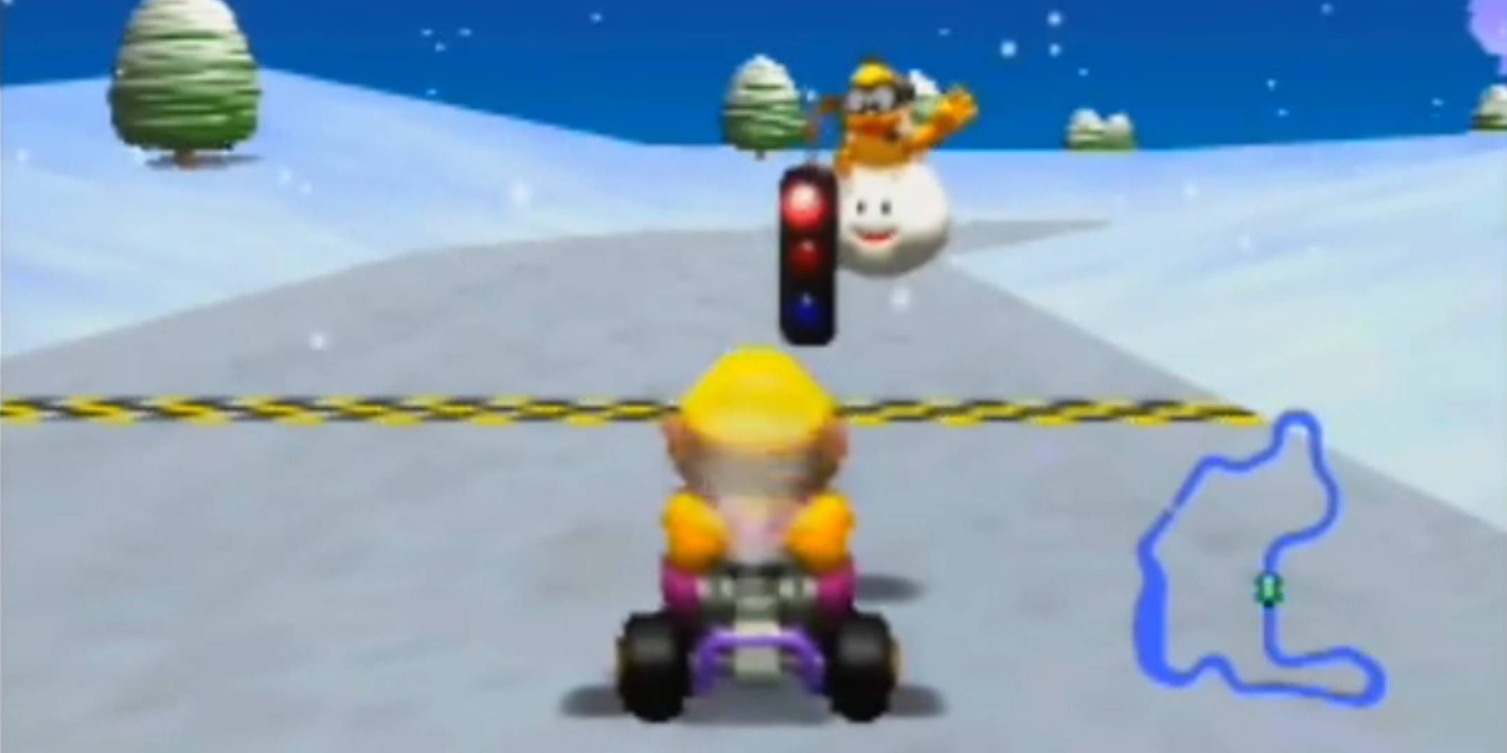Wario about to start a race in Frappe Snowland in Mario Kart 64.