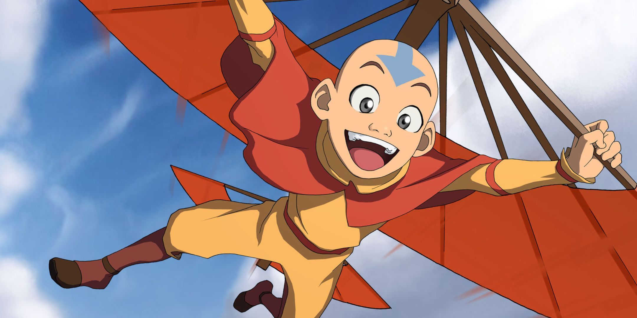 Aang from Avatar: the Last Airbender gliding in the air and smiling