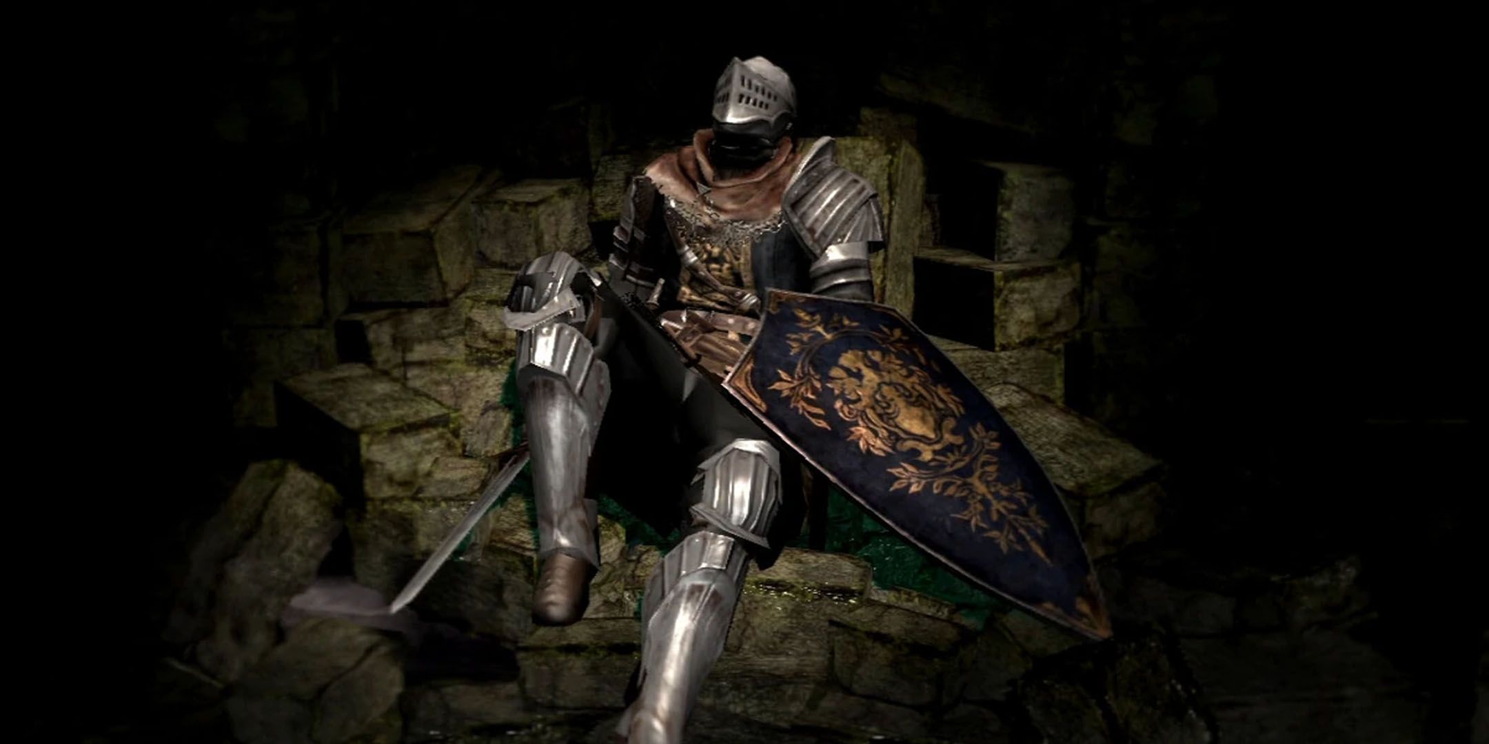 Dark Souls screenshot of Oscar lying down on a pile of rubble.