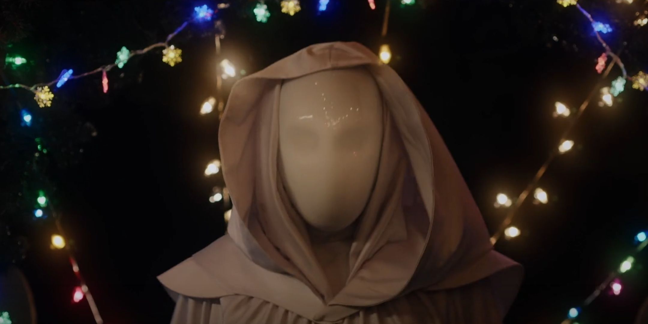 A masked murderer dressed in white looks adverse in it is a wonderful knife. 