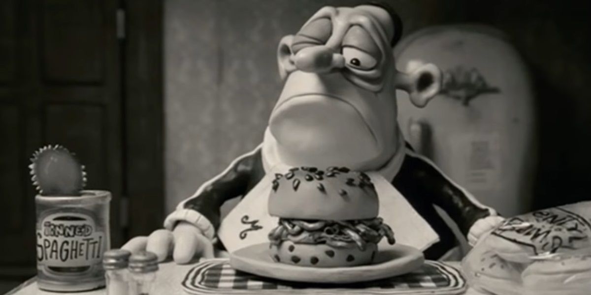 Max about to eat a burger in Mary And Max.