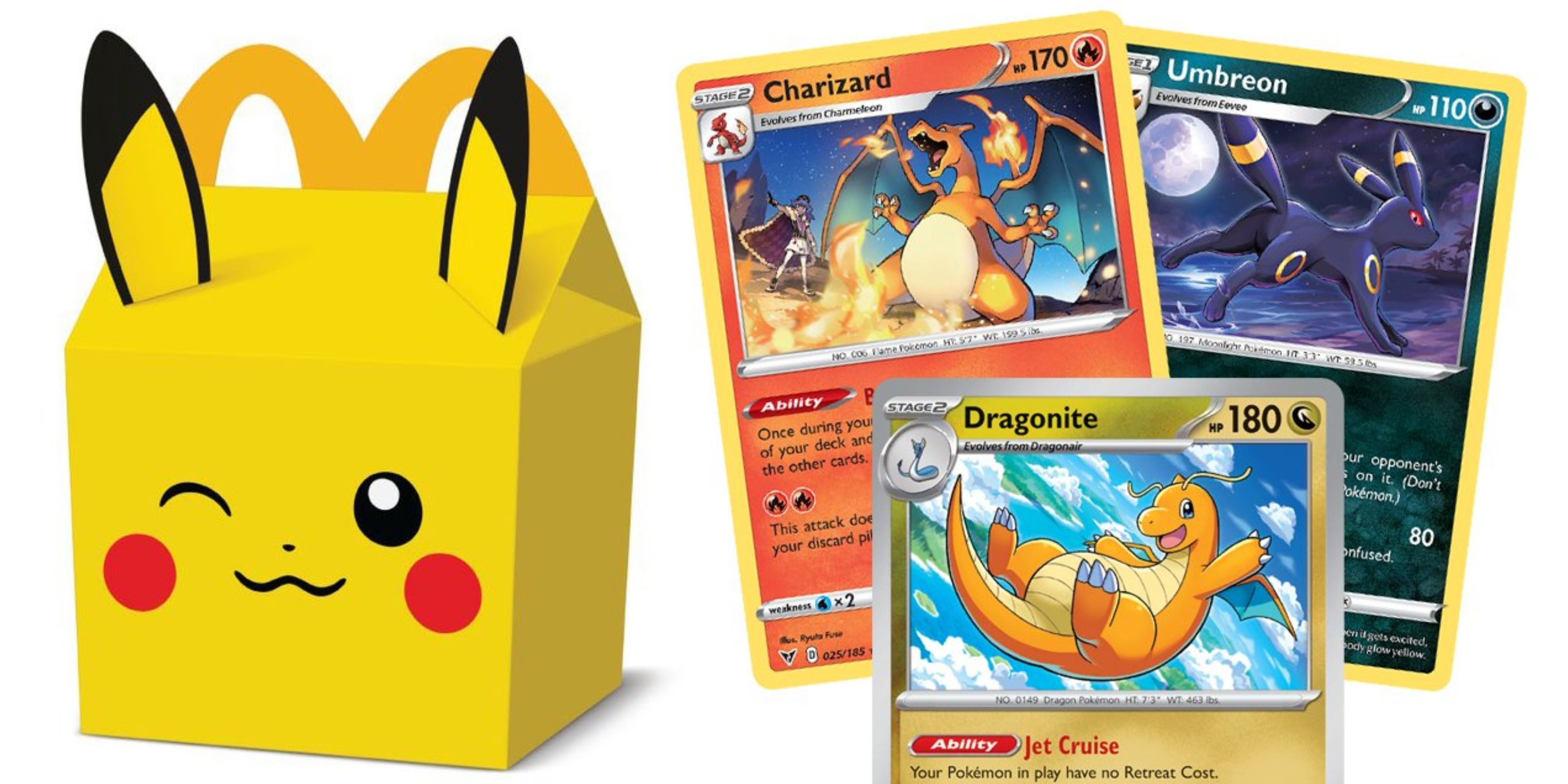 pikachu mcdonald's happy meak box next to dragonite, charizard, and umbreon cards.