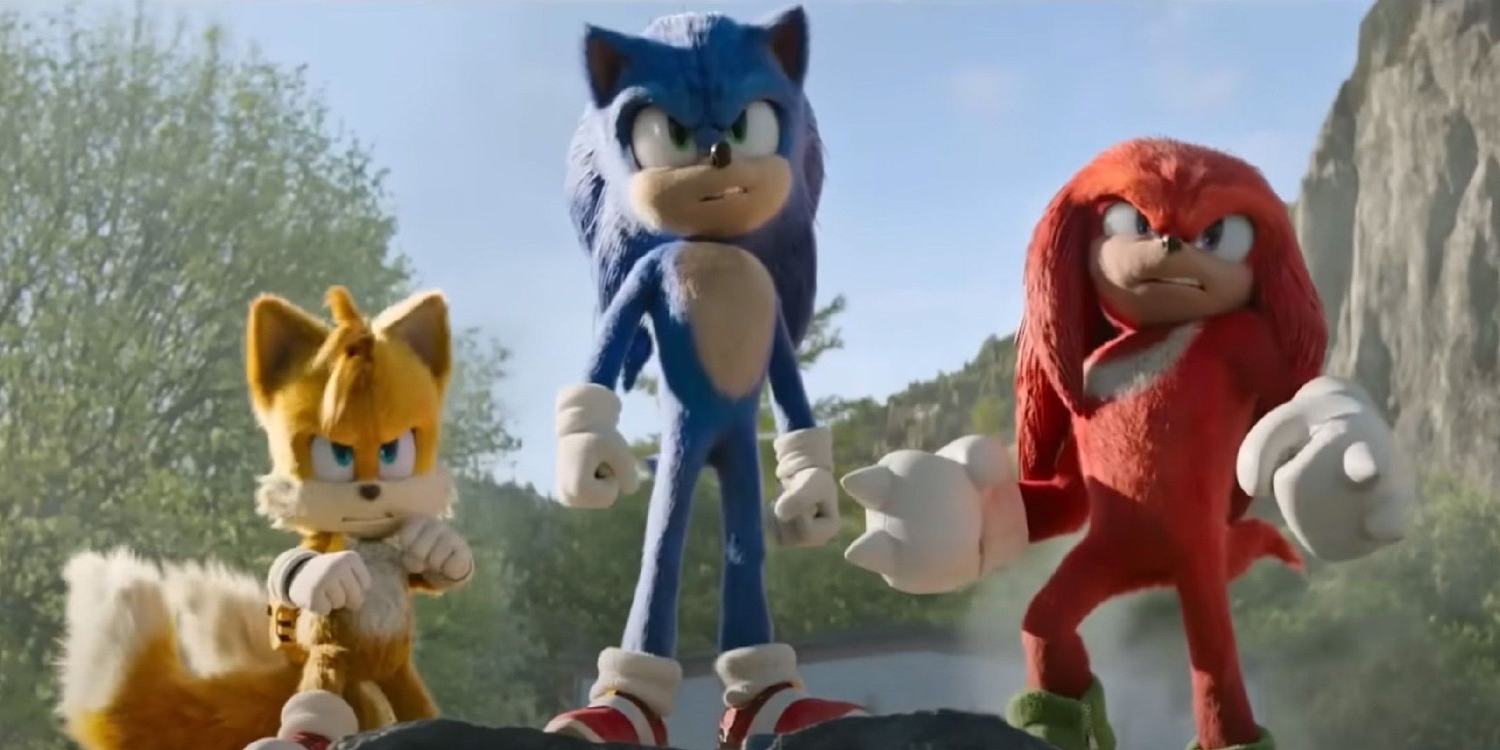 Sonic, Tails, and Knuckles standing on a piece of rubble in Green Hills from Sonic 2 movie.