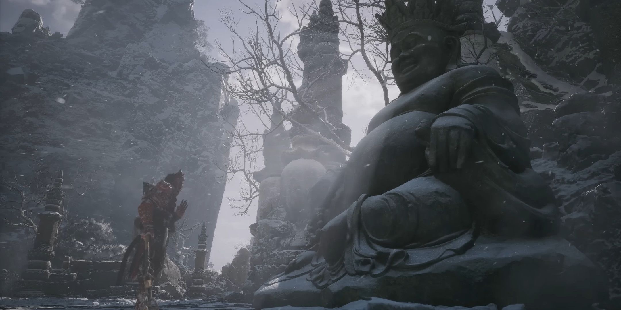 Sun Wukong praying at a large Buddha statue