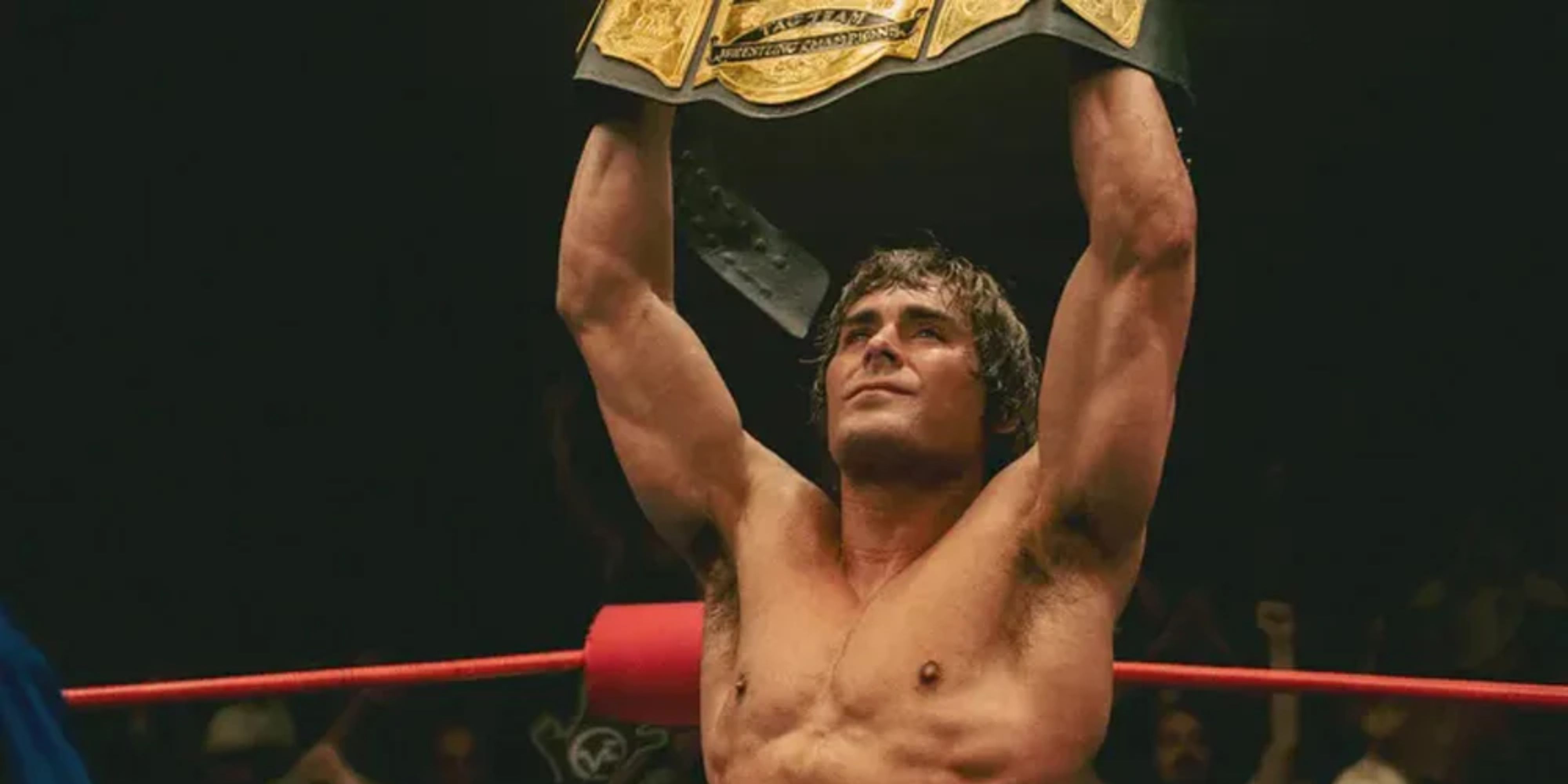 Zac Efron lifting a belt in The Iron Claw