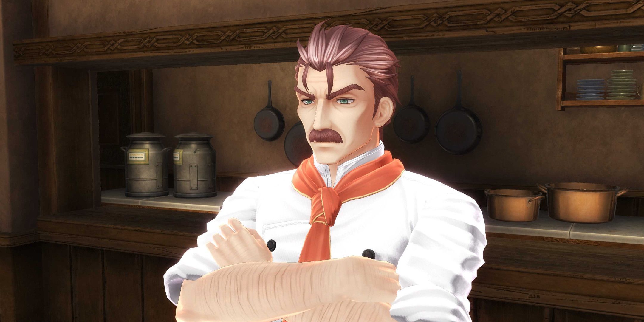 A grumpy looking chef with a moustache stood with his arms crossed