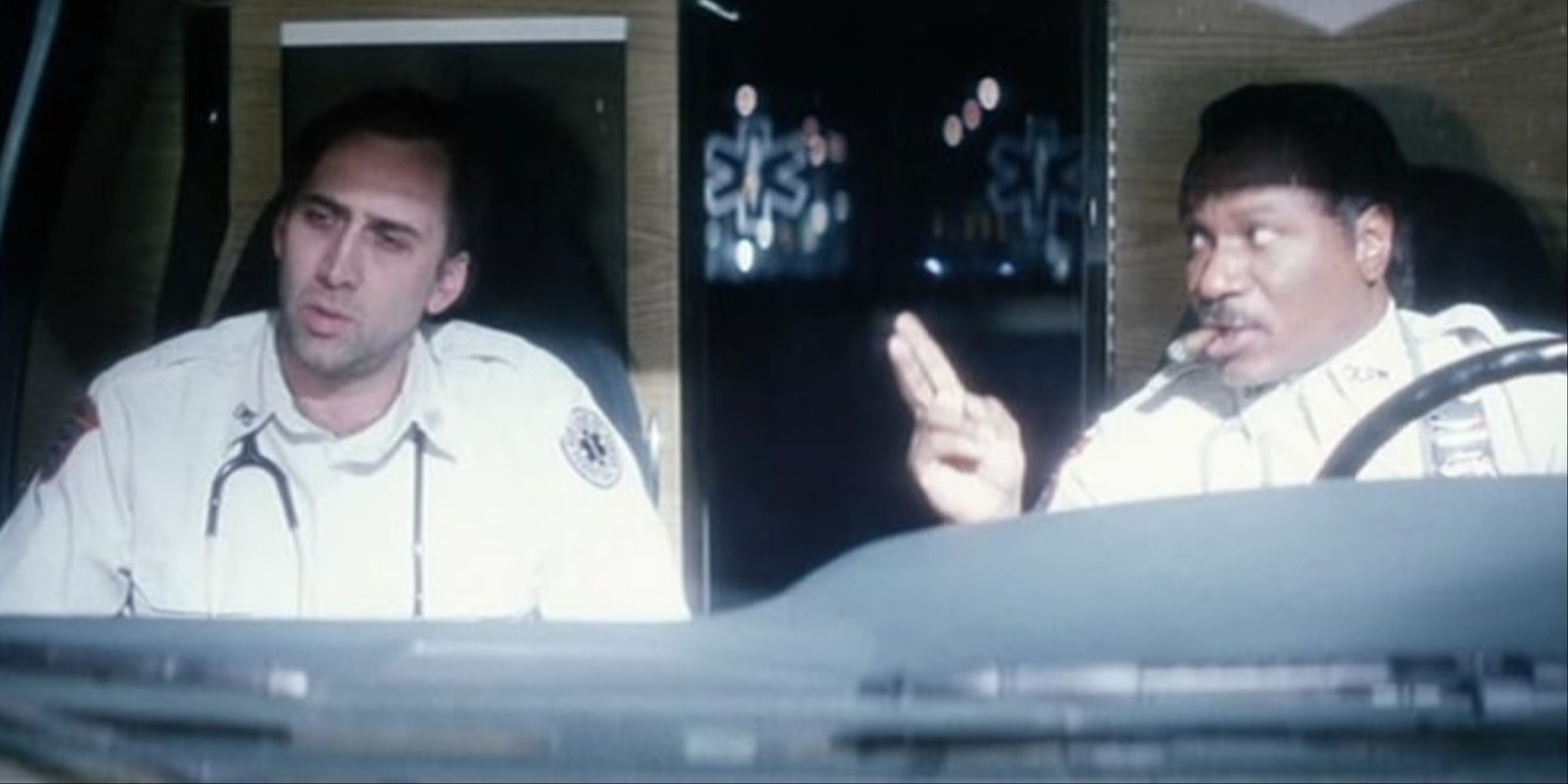A sleep-deprived Nicolas Cage and a cigar-smoking Ving Rhames inside an ambulance in Bringing Out the Dead.
