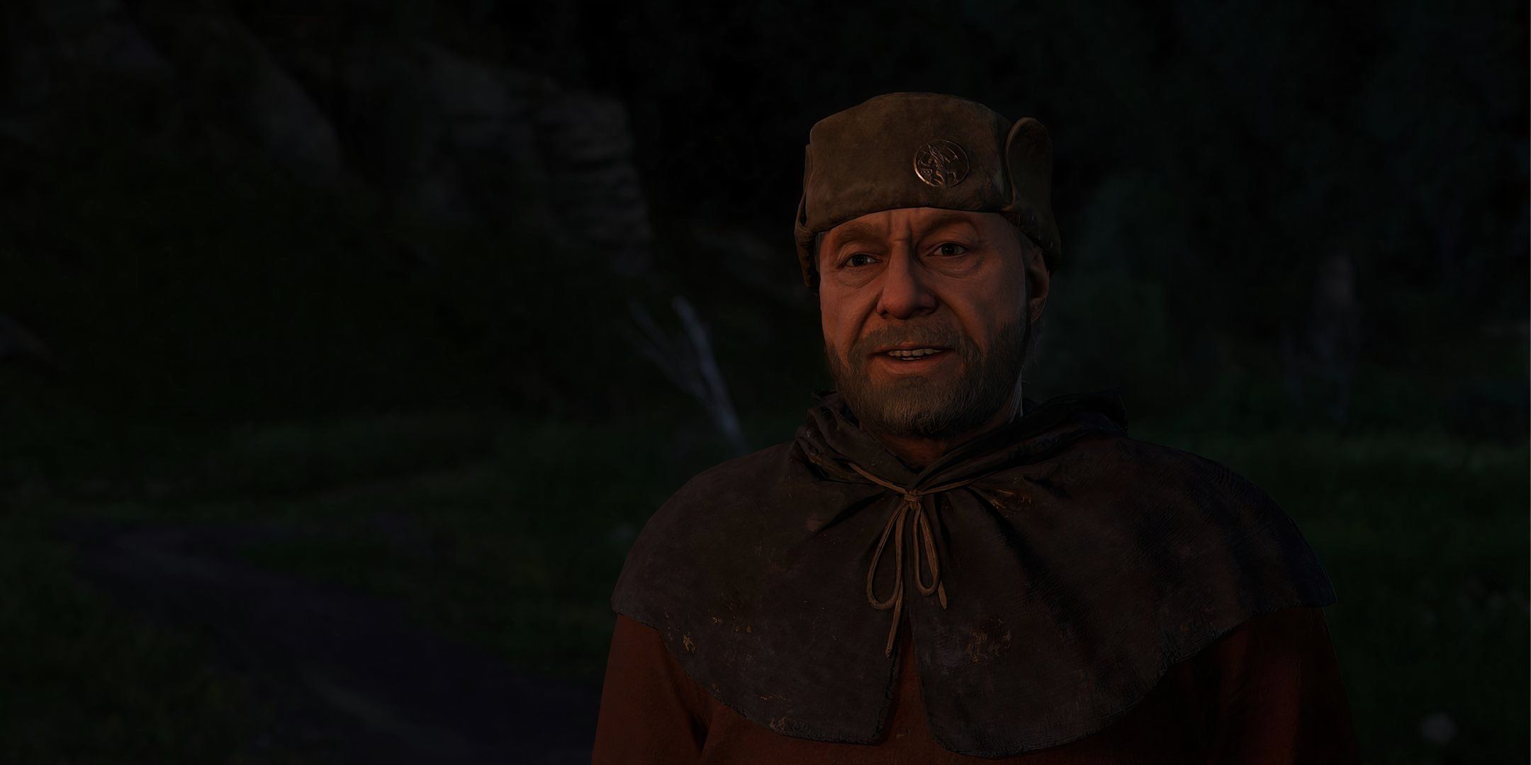 Kingdom Come: Deliverance 2 - A closeup shot of the Happy Man by the roadside.