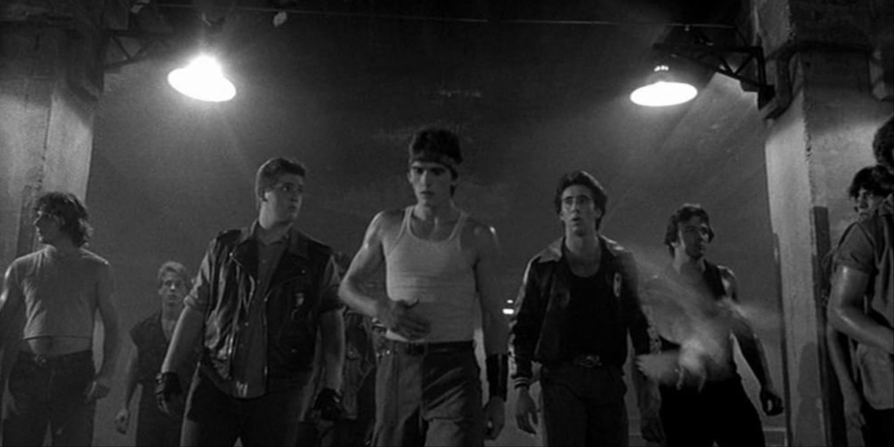 Matt Dillon, Nicolas Cage, and other cast members in the black-and-white movie Rumble Fish.